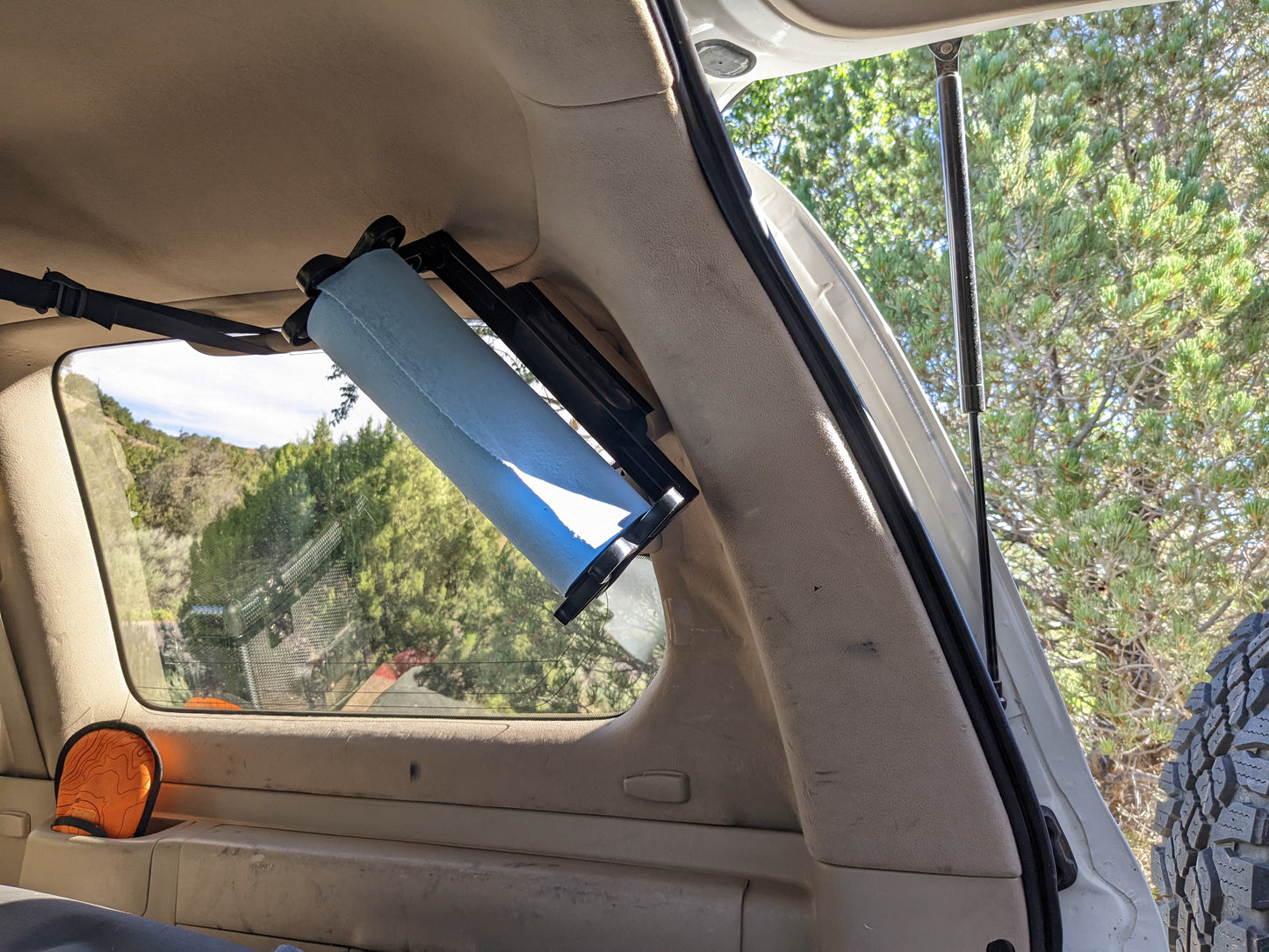 100 Series LC/LX Third Row Seatbelt Paper Towel Mount
